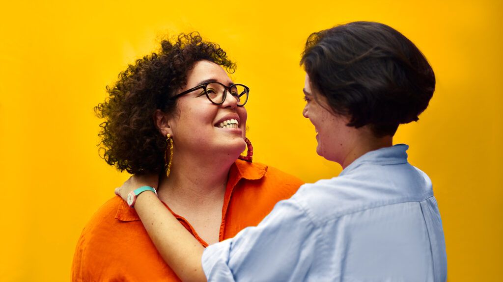 Female couple smiling and showing affection