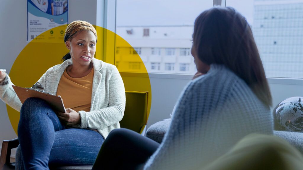 black woman talking to culturally competent therapist